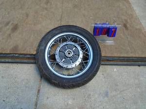 15 oldermotorcycle wheel & tire assembly. Unknown brand. As shown.