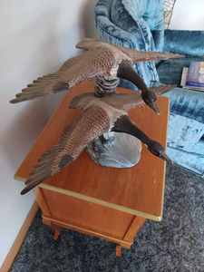 lot 9 image: Pair of Ceramic Canadian Geese in Flight, 23 inches wide by 10.5 inches tall by 17-inches Beak to Tail