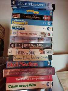 lot 27 image: More than 50 VHS Movies and Shows and One VHS Plastic Storage Shelf