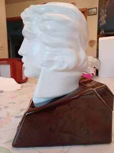 lot 72 image: McCormick Distilling Co. Elvis Decanter 1977, Seal is Broken, Glue let loose where Elvis Sits on the Bottle Base