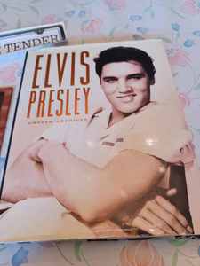 lot 113 image: 383 Page Book Elvis Presley Unseen Archives, Brochure of Elvis Presley Birthplace, and a Love Me Tender Bumper Sticker