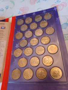 lot 114 image: 50 States Quarters with Paperback Booklet The 50 States