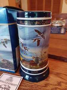 lot 140 image: 2006 Holiday Stein Program Terry Redlin Collector Stein Series Silent Sunset Licensed by Miller Brewing Company