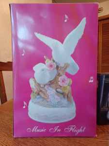 lot 142 image: Seven Curio Pieces Wings of Porcelain-Doves Music in Flight in Original Box, Illuminated Praying Hands Figurine