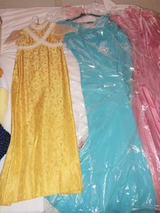 lot 162 image: Three Formal GownsDresses, Gold Dress, Turquoise and Rose Colored Dresses