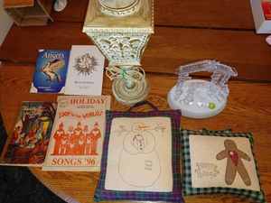 lot 187 image: Christmas Decorations, Song Books, and Meditations, Two Small Decorative Pillows, Battery Operated 7-inch tall Nativity Set