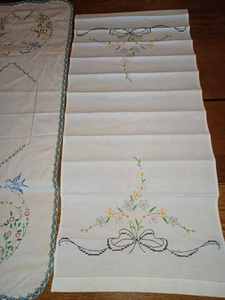lot 190 image: Six Assorted Vintage Dresser Scarves and Table Center Cloths - Some are Stained 17-inch by 23-inch, 15-inch by 37-inch