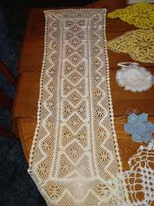lot 192 image: 12-Doilies, a 13-inch by 39-inch Dresser Scarf and Embroidered Round Piece 11-inches Round