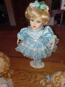 lot 195 image: Three Dolls Ballerina with Metal Stand 13-inches Tall, Doll 15-inches tall with two Different Shoes, and Doll with No Shoes 12-inches