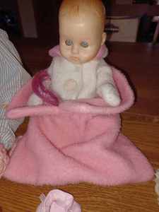 lot 196 image: Baby Doll 19-inches tall, Baby Doll 10-inches tall, Princess Pillow, Childs Neck Pillow, Childs Pair of Formal Gloves