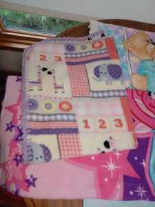 lot 199 image: Baby Blanket, Spread and Childs Blanket with Ferry Pattern, Opa & Oma Together Hard Cover Book, Babys Keys Toy, and More
