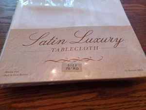lot 218 image: New 70-inch Round Satin Luxury Table Cloth, Cotton Table Cloth, Cotton Napkins, Dish Towels, and 2 Plastic Reusable Table Cloths