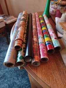 lot 219 image: Christmas Decorations Metal Angel Card Holder, Virgin Mary and Baby Jesus Centerpiece, New Tissue Wrap, Assorted Rolls of Gift Wrap