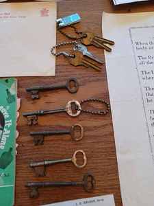 lot 256 image: 5 Skeleton Keys, Vintage Key Chains, Eldon Road Race Accessories Brochure, Miniature Aluminum Anvil, 1944 Deutschland 10 Zehn Mark