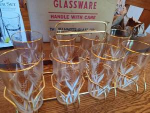 lot 305 image: Set of Jeannette Glass Co. Glasses and Metal Caddy in Original Box, Libbey 3-Piece Shaker Set, and 4-Piece Martini Glass