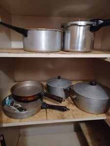 lot 313 image: Six Vintage Cookware Pieces Dutch Oven, Sauce Pan, 2-Skillets, 2-Pressure Cookers (One with a Weight)