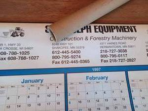 lot 323 image: 1997 St. Joseph Equipment Calendar, Yankee Screw Driver, New Atwood Boat Plug, Small Dinner Bell Triangle,