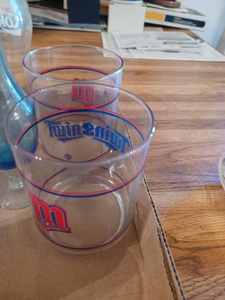 lot 332 image: Pair of Minnesota Twins Glasses, 3-Assorted CocaCola Glasses, Garfield Mug from McDonalds, Rubber Dice Cup with Di