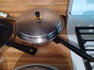 lot 357 image: 3-Piece Set of Cookware 10-inch Skillet with Cover, an 8-inch Sauce Pan with Cover, and 3 Other Sauce Pans with Covers