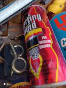 lot 374 image: Box of Hardware Unicut 7.25-inch Tungsten Carbide Tipped Blade, Hose Spray Nozzle, Bottle of ISO-Heet, and More