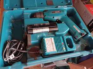 lot 378 image: Makita 6172D 38-inch Cordless Drill with 2-Batteries, Charger and Flashlight, Drill is with a Makita Case