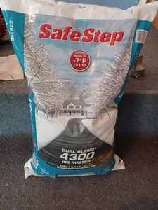 lot 395 image: 20 lb. Bag of Safe-Step Dual Blend 4300 Ice Melter and a Partial Plastic Container of Ice Melt
