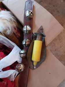 lot 405 image: Two Boxes and a Bag of Christmas Decorations St. Nicholas, 5 Sleigh Bells on a Leather Belt, Silk Poinsettias, Garland,