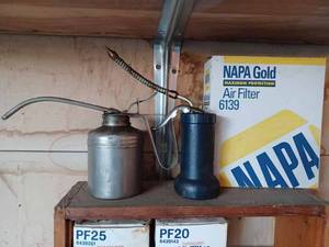 lot 439 image: Quart of NAPA ATF, Several Plastic Funnels, Rub-O-Matic Rubber Cleaner, Two Oil Cans, NAPA 6139 Air Filter, 2 Oil Filters