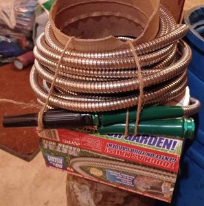 lot 453 image: Two Ultra Flexible Metal Garden Hoses - One is New in the Original Package, Each Hose is 50-feet