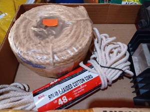 lot 505 image: Box with a MultiBattery Isolator, New 935 lb. Anchor Rope, New Solid Braided Cotton Cord, and a New 50-foot Sisal Rope