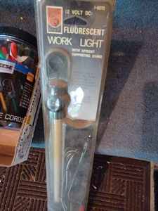 lot 532 image: Two New Fluorescent Work Lights in the Package and a Box of Rubber StrapsTie Downs