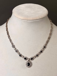 lot 107 image: Gorgeous 14k White Gold Sapphire and Diamond Halo Style Necklace