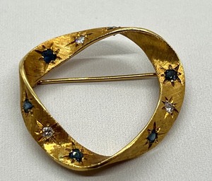 lot 4A image: Gorgeous Cartier Twisted 18k Sapphire and Diamond Brooch