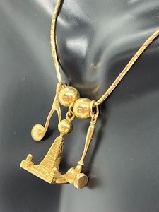 lot 114 image: Womens 14k Gold Chain with Charms