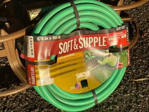 lot 152 image: 2 Metal Hose Reels And A 50 Foot Garden Hose