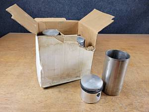 lot 2011 image: New Old Stock Pistons and Sleeves - Part No. 602000