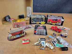 lot 2035 image: Lot of 124 Diecast Cars, Hood Ornament, Keychains, Novelty Matches and More