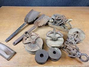 lot 2055 image: Lot of Wood & Cast Iron Barn Pulleys and More