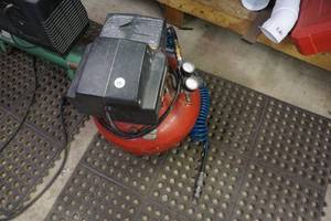 lot 10 image: Porter Cable 150 PSI Pancake Style Air Compressor