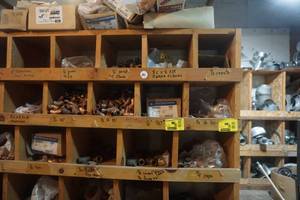 lot 25 image: Large Partition Storage Rack Filled With Assorted Copper Fittings