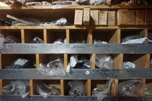 lot 29 image: Metal Partitioned Storage Rack With Assorted Pex Water Line Fittings