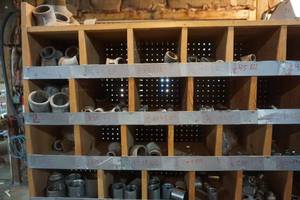 lot 32 image: Large Partitioned Storage Unit With Assorted Galvanized Fittings