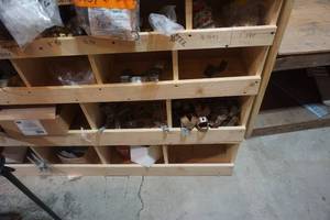 lot 42 image: Partitioned Shelving Unit With Pipe Hangers and Clamps and Push Connect Fittings