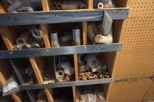 lot 46 image: Partitioned Shelving With Assorted Brass Fittings