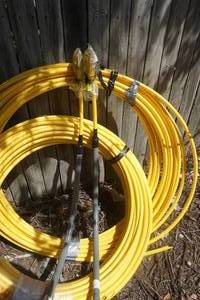lot 87 image: 250 Roll and Partial Roll of 12 Gas Line Pipe With 2 Union Connectors