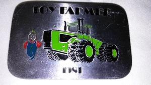 lot 626 image: Steiger Belt Buckle, Toy Farmer, 1 Of 1,000.