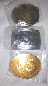 lot 627 image: (3) John Deere Lawn & Garden Tractors Belt Buckles