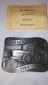 lot 634 image: Farmall BELT BUCKLE 7288 1984 International Harvester