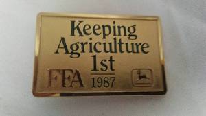 lot 635 image: FFA, JOHN DEERE BELT BUCKLE 1987 Keeping Agriculture 1st