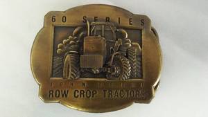 lot 642 image: John Deere BELT BUCKLE 60 Series Tractor